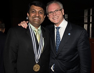 Dr Harish Hosalkar being congratulated by Dr Gerald Williams